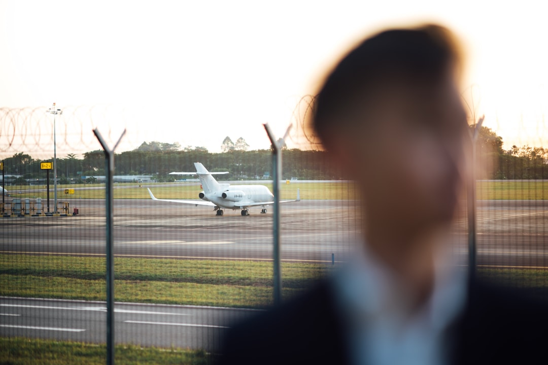 white airplane on airport during daytime