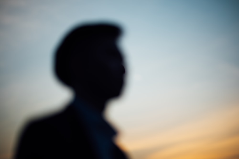 silhouette of man during sunset