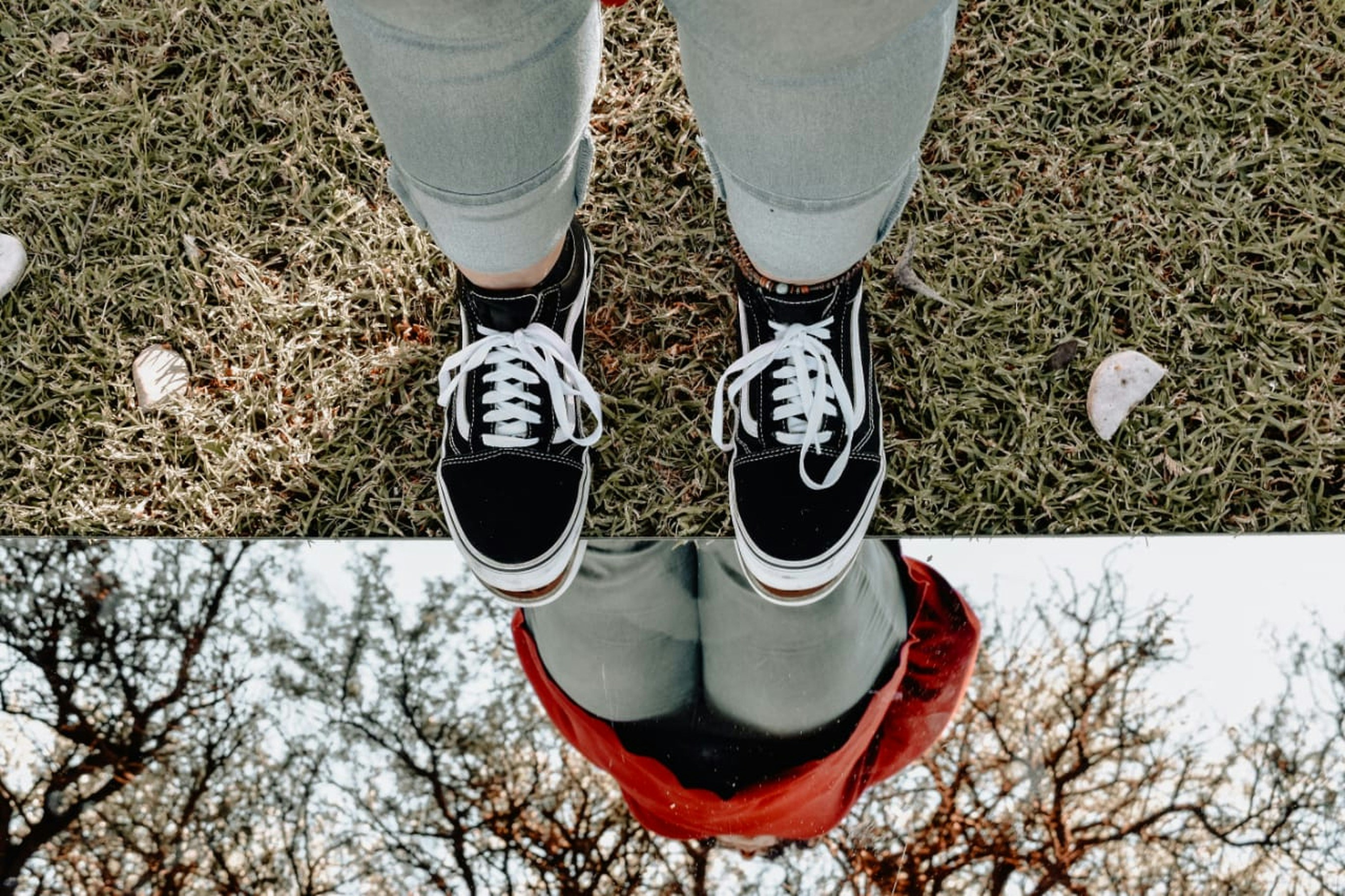 person in black and white nike sneakers