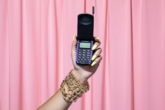 person holding black qwerty phone