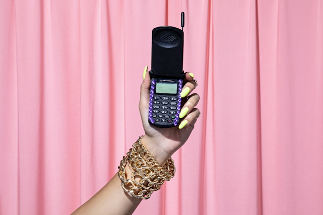 person holding black qwerty phone
