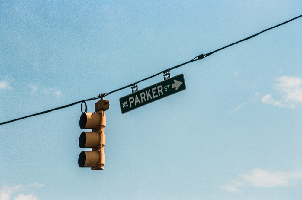 black traffic light with orange light