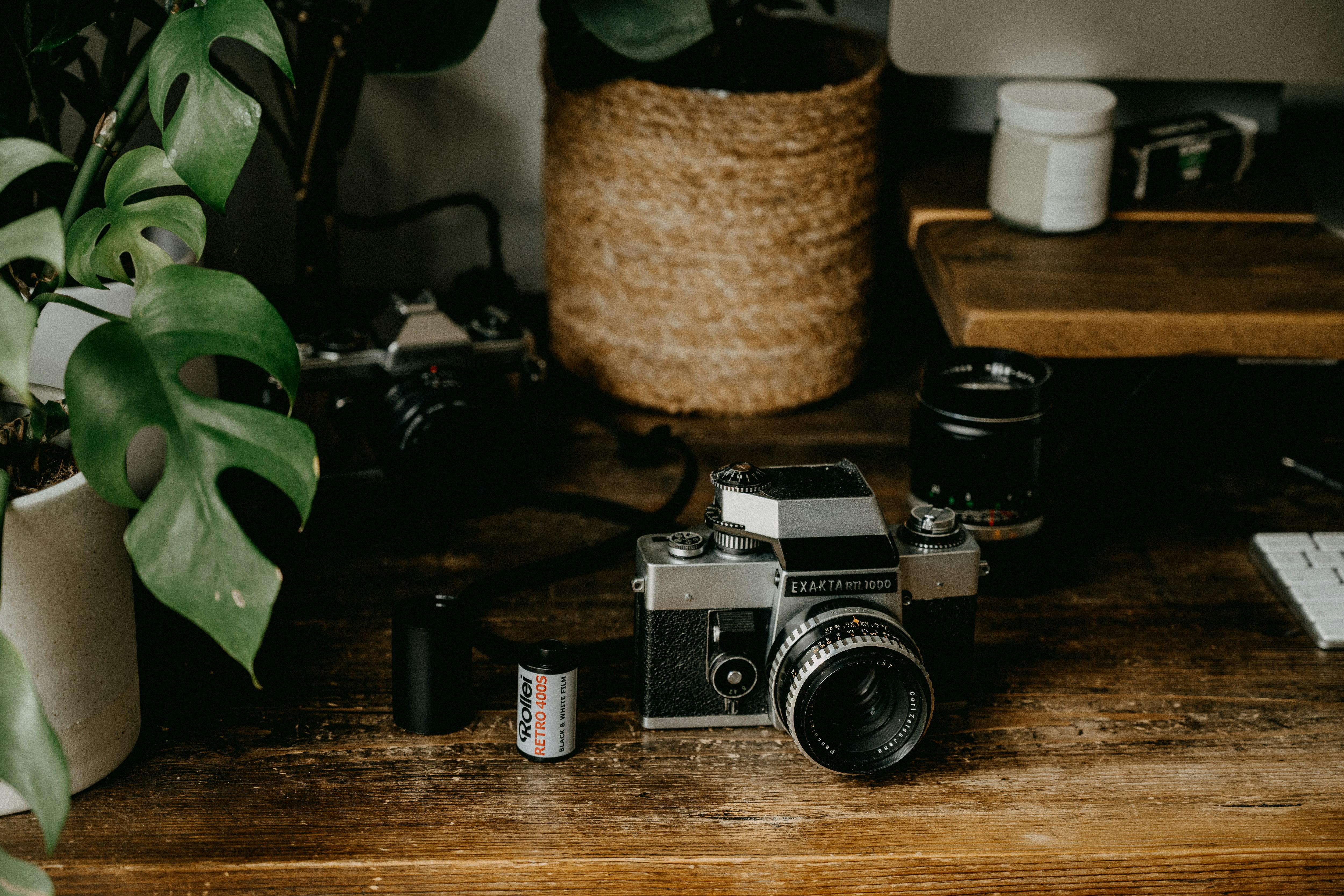 black and silver camera on brown wooden table