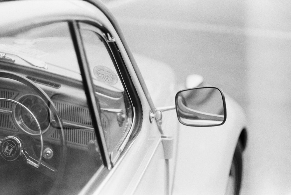 grayscale photo of car side mirror