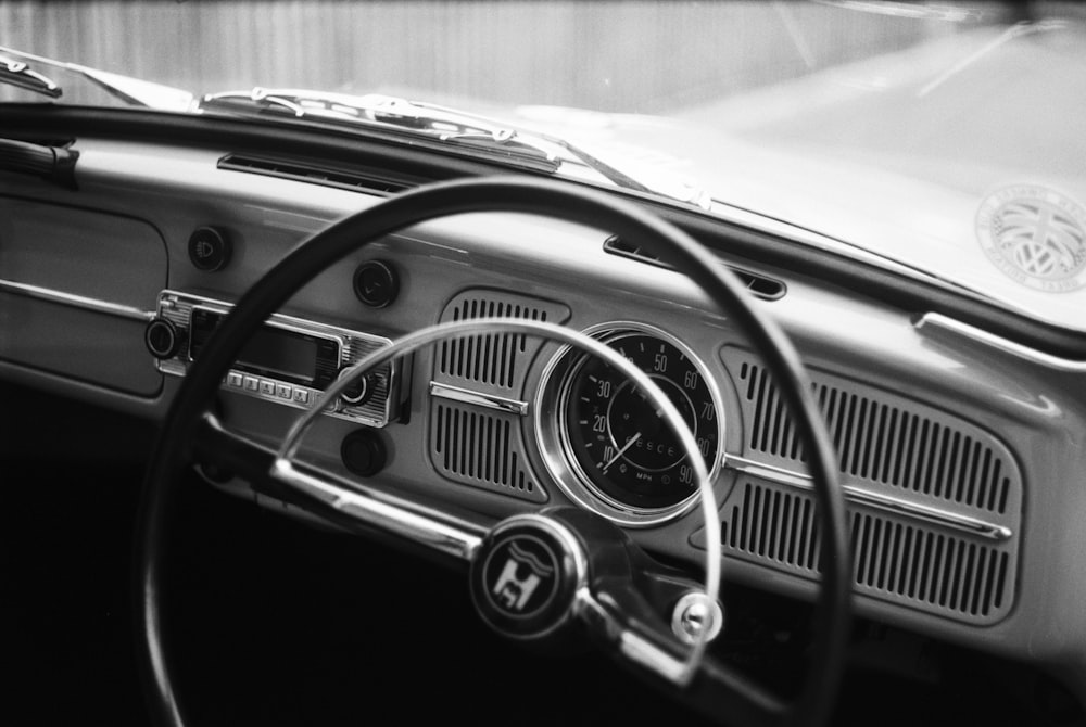 grayscale photography of car steering wheel