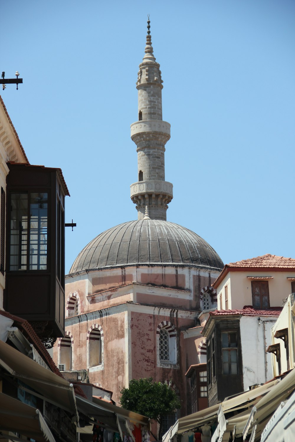 white and brown concrete building under blue sky during daytime