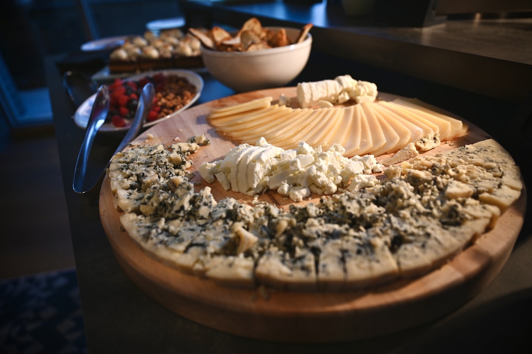 brown round cake on brown wooden tray, Cheese Plate.