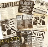 A collage of black-and-white concert flyers featuring bands like Pixies, Mudhoney, Red Hot Chili Peppers, Nirvana, Jane's Addiction, Sonic Youth, Faith No More, Ministry, and Nine Inch Nails. The flyers display various concert dates, venues, and details in a vintage style.