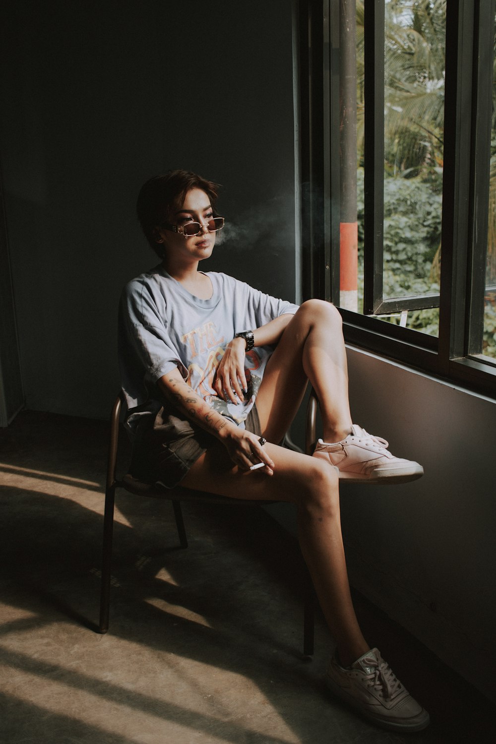 woman in white long sleeve shirt sitting on chair