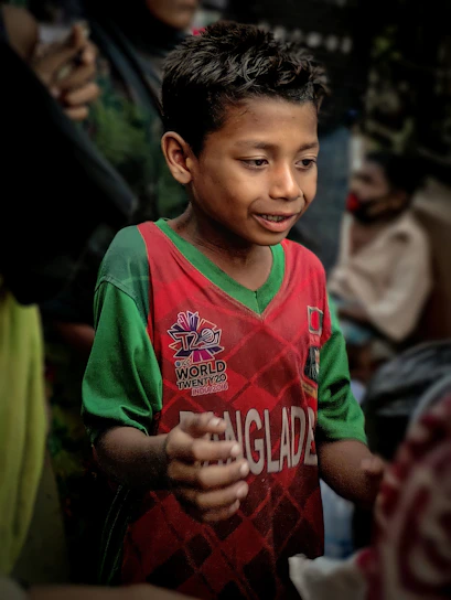 A group of enthusiastic Bangladeshi youth engaged in a hands-on skill training workshop.