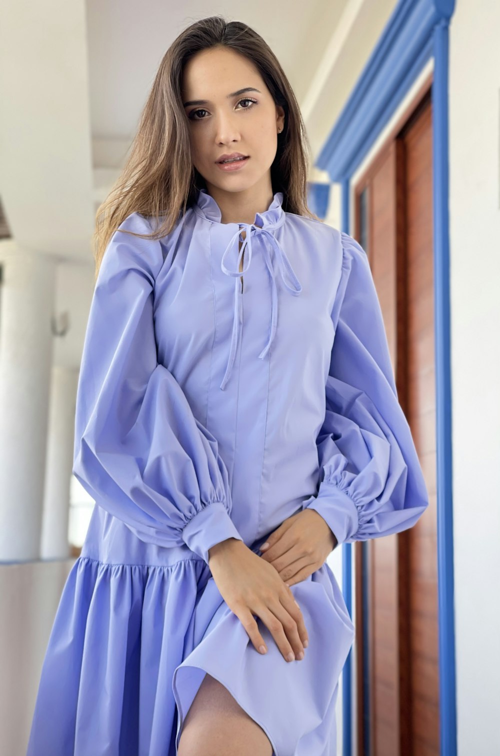 woman in blue dress shirt and black skirt