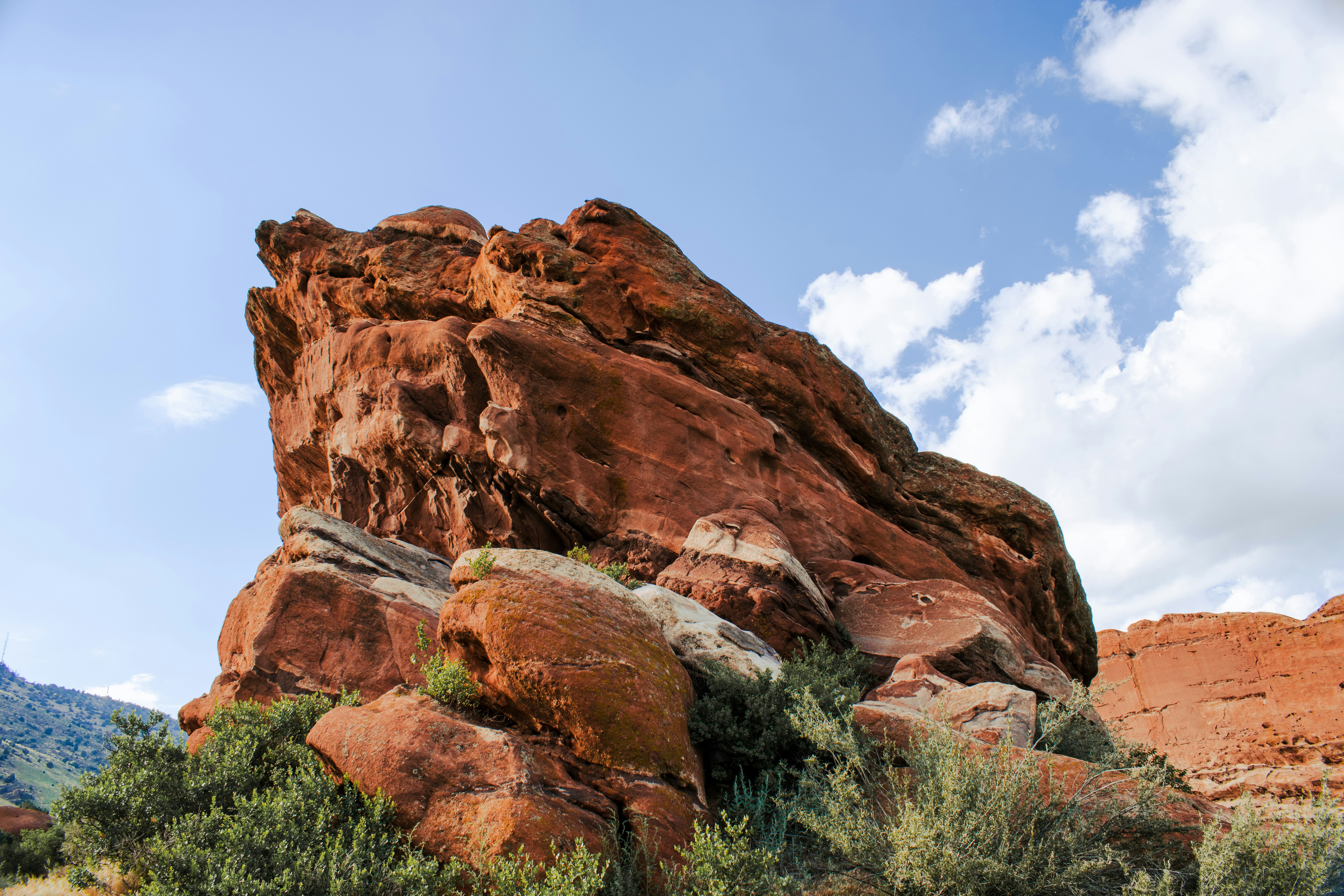 brown rock formation under blue sky during daytime, i loved the color of these rock formations