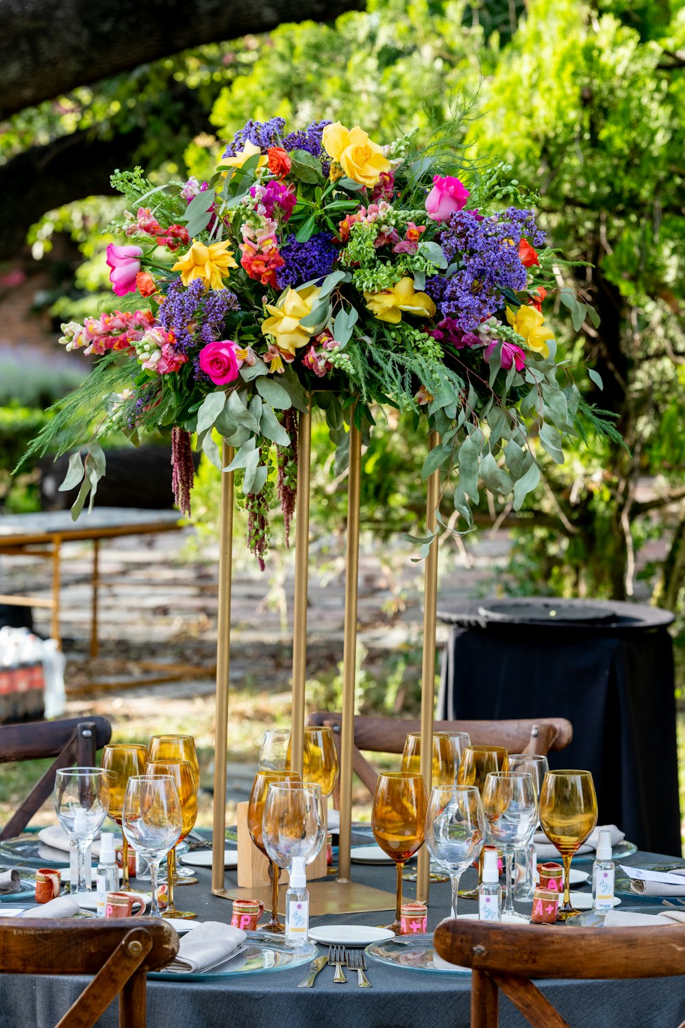 pink and yellow flowers in clear glass vases