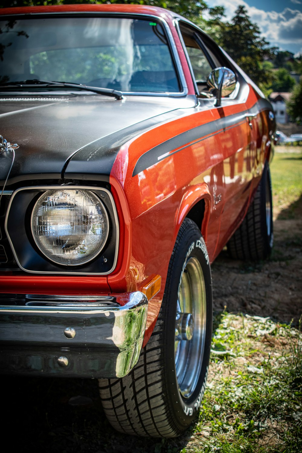 red car on brown soil