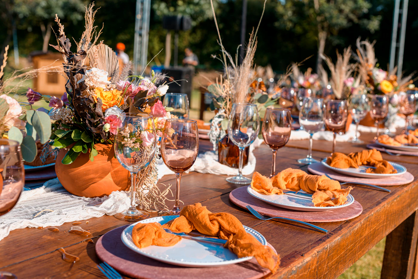 How to choose a wedding caterer for food allergies — A catering team placing labeled dishes on a wedding buffet
