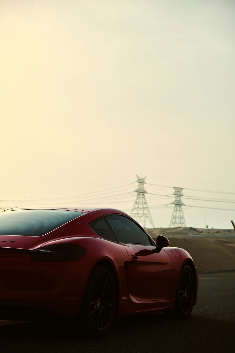 red ferrari sports car on road during daytime