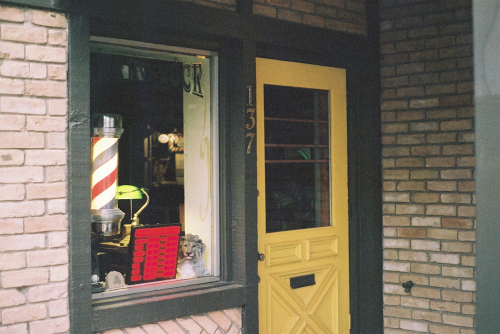 yellow wooden framed glass door