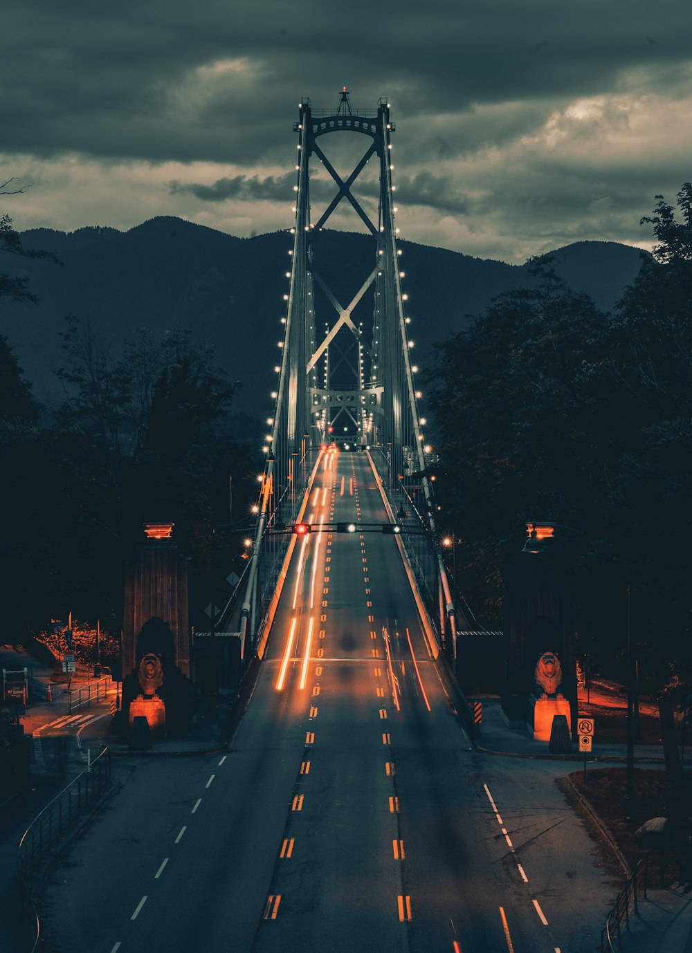 people walking on gray concrete road during night time