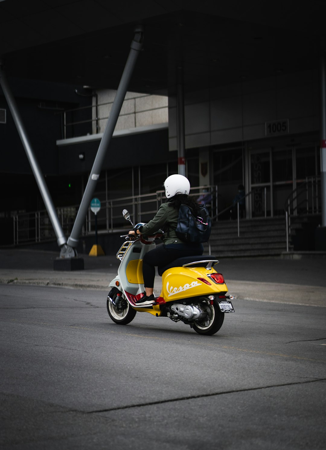 man in white helmet riding yellow and black motorcycle