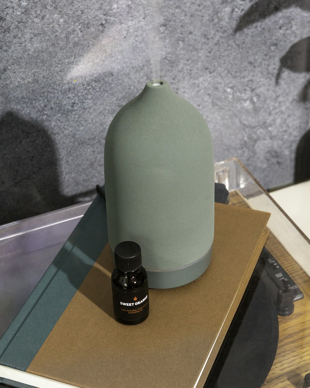 green plastic container on brown wooden table