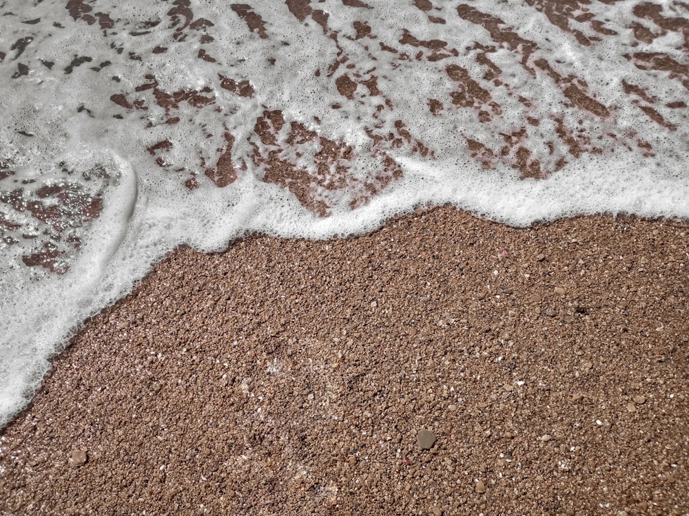 white and brown sand on brown sand
