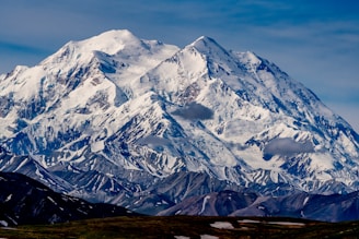 snow covered mountain during daytime