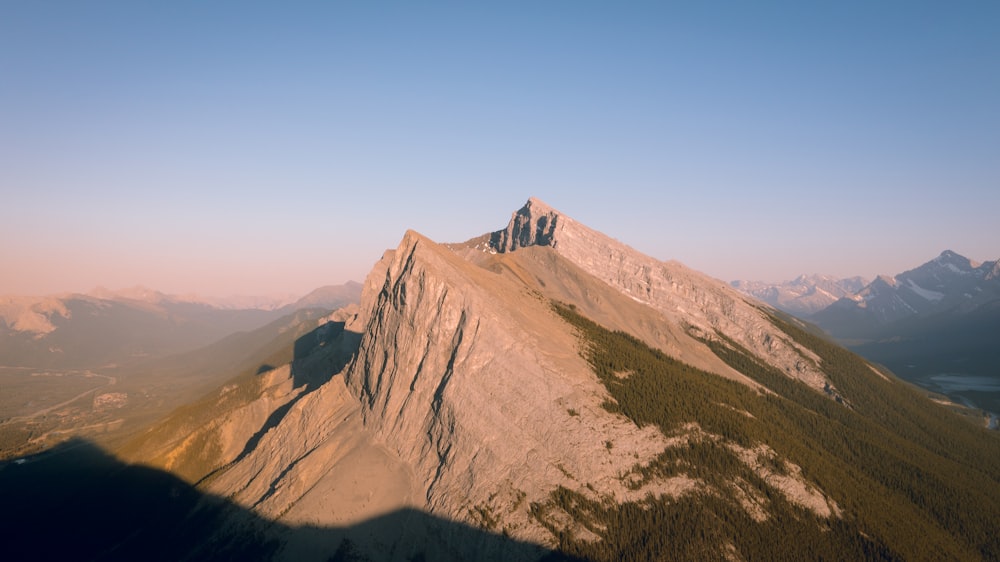 brown mountain under blue sky during daytime