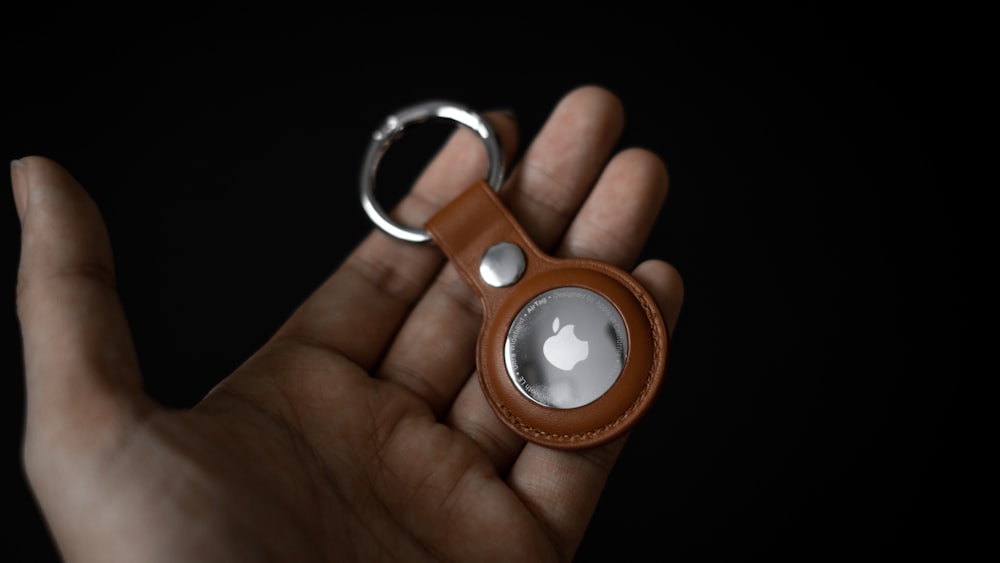 person holding silver and white magnifying glass