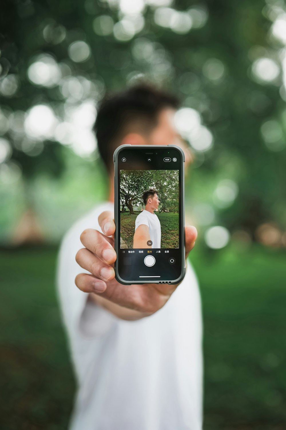 person holding black iphone 4