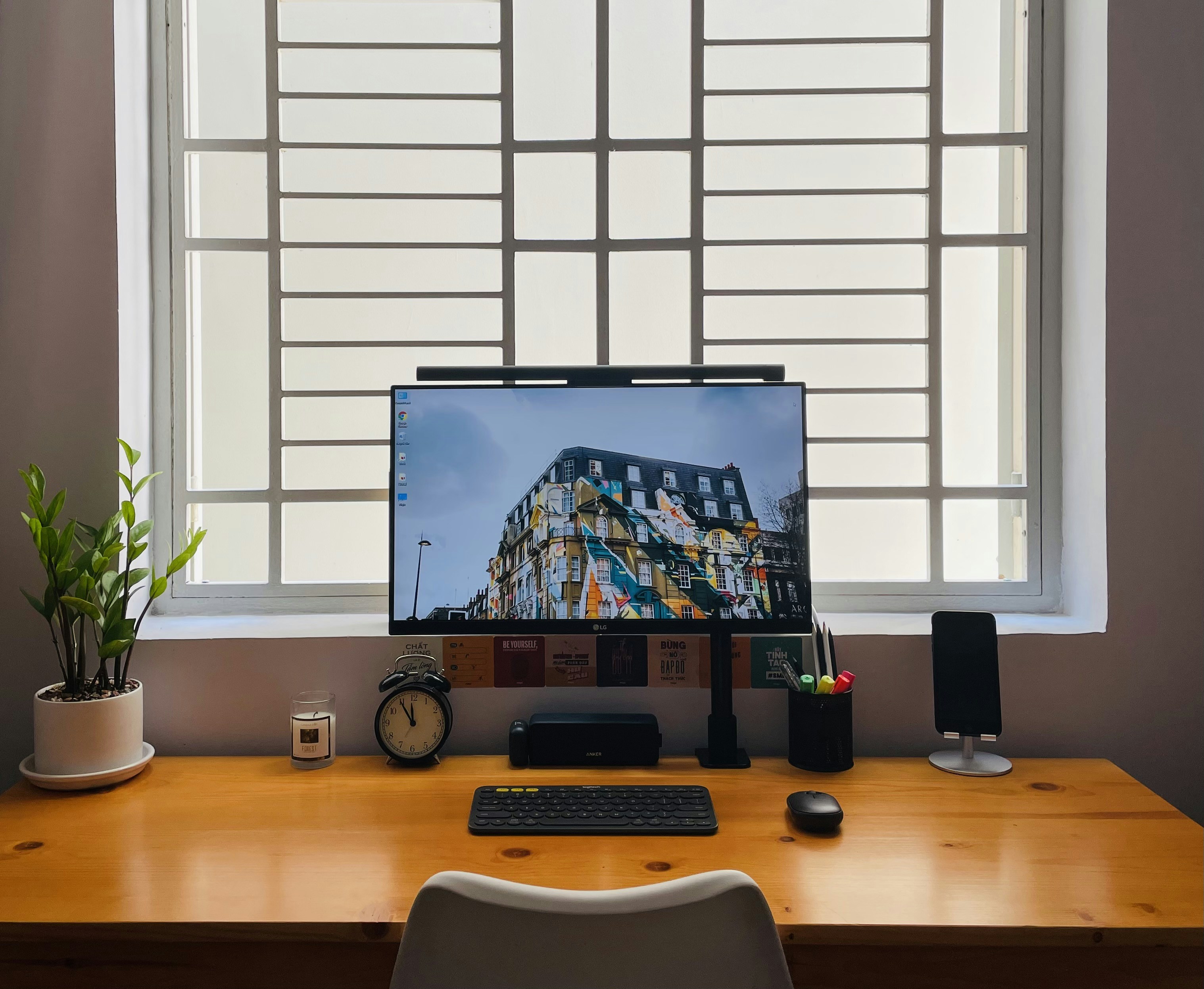 Black monitor on wooden desk