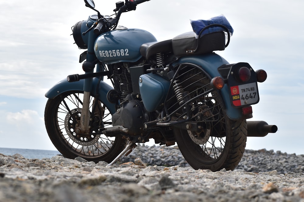 black and gray motorcycle on brown sand during daytime