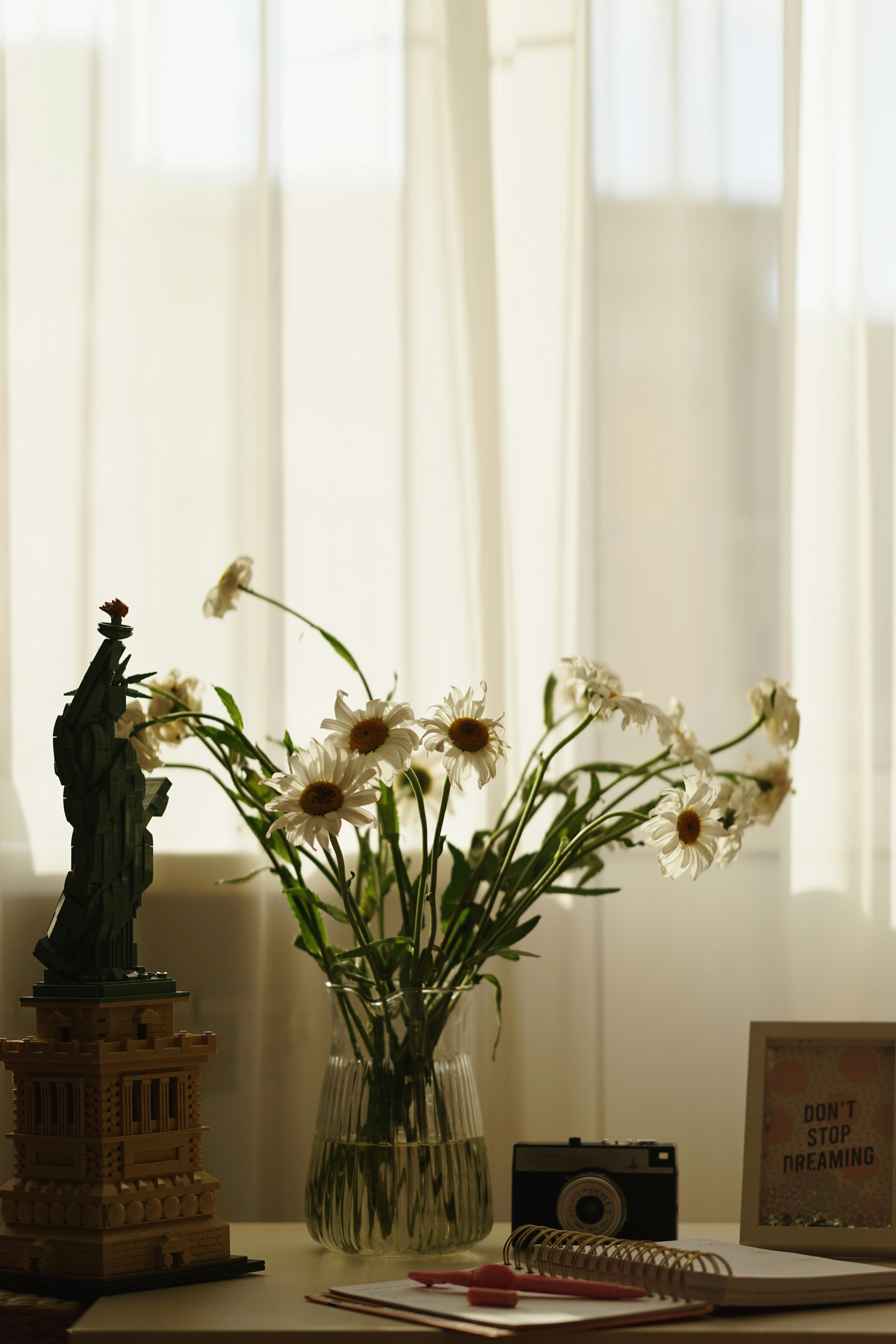 white flowers in clear glass vase