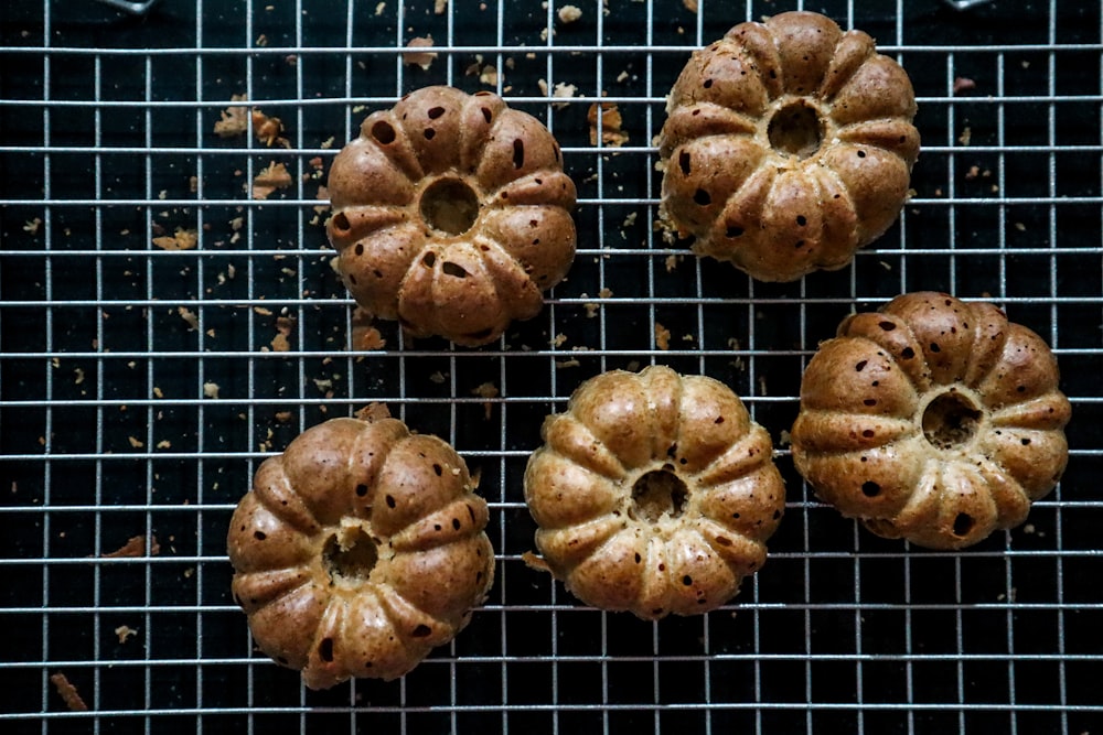 brown cookies on black metal grill