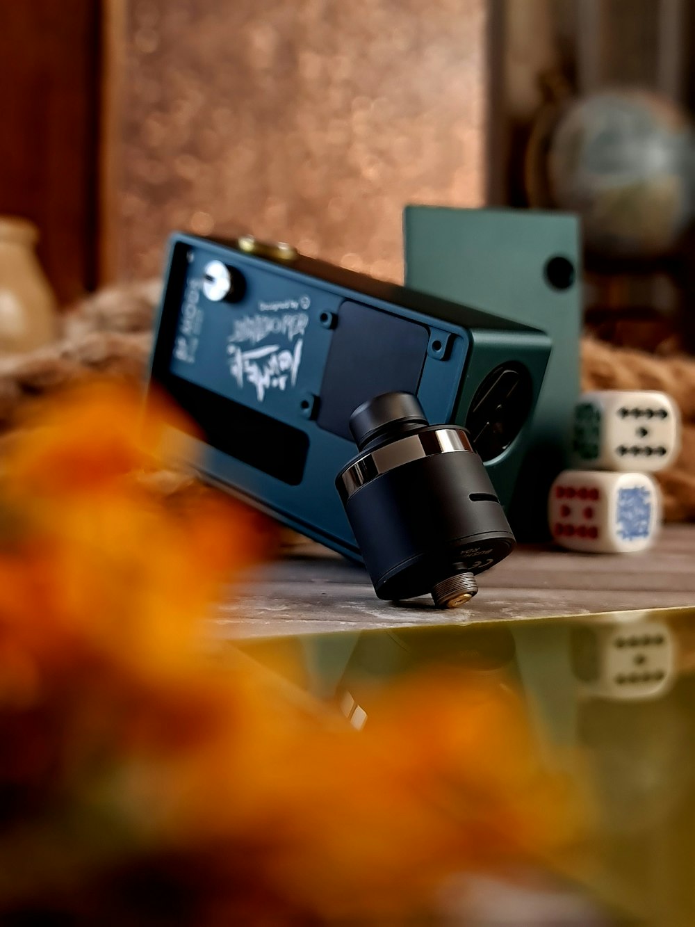 black and silver camera on glass table