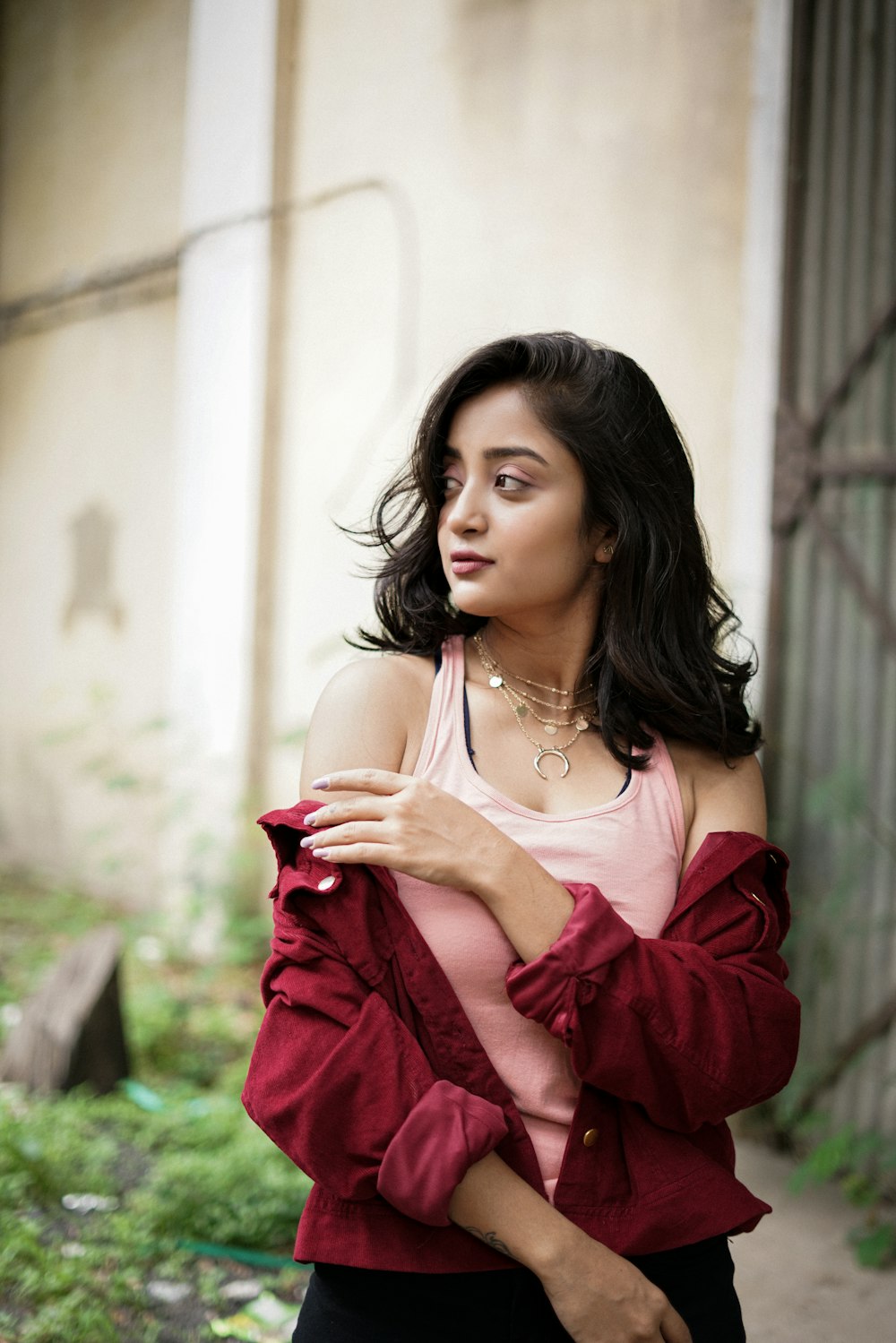 woman in red dress wearing gold necklace