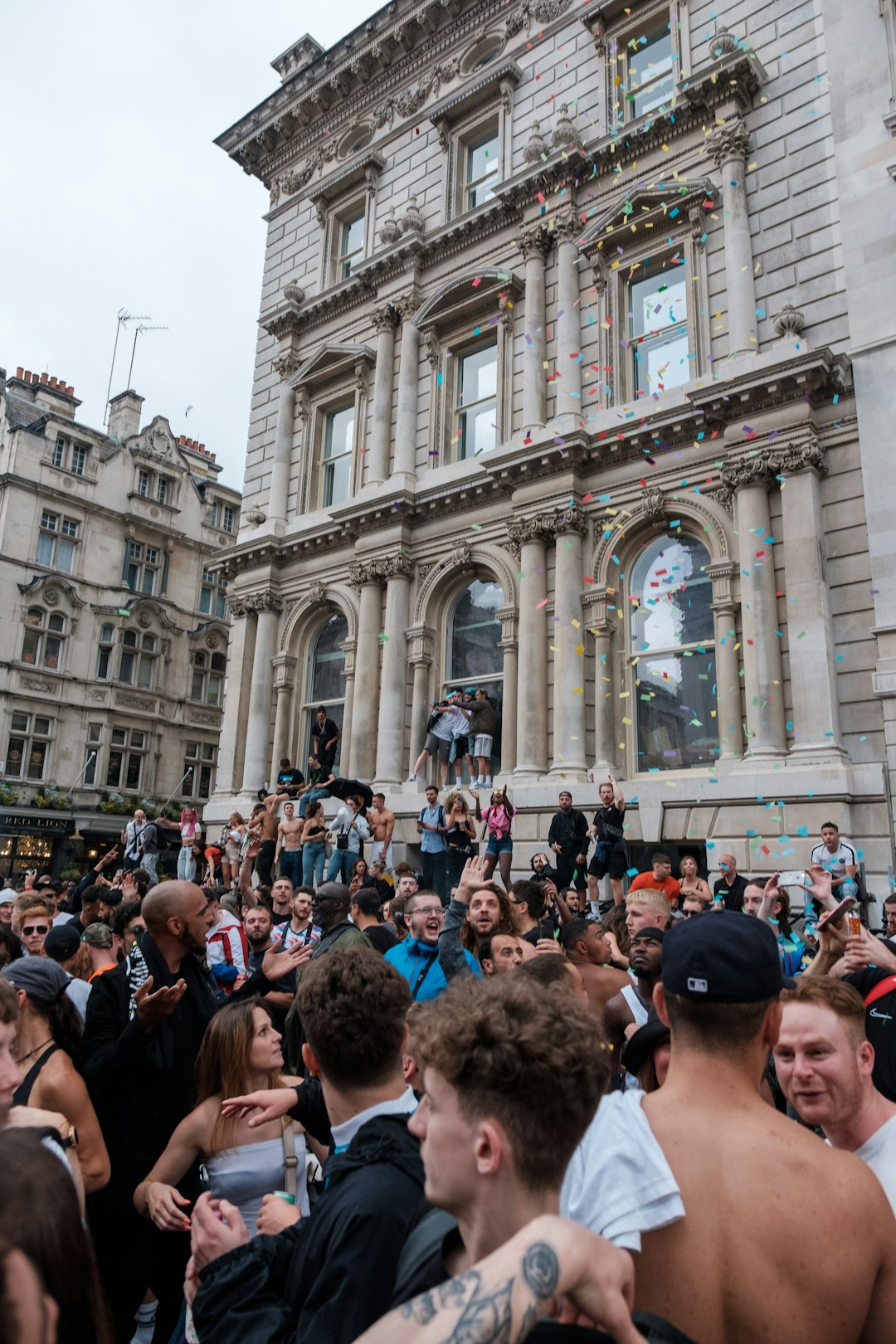 people in front of white concrete building during daytime