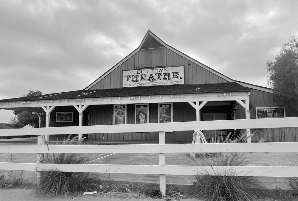 grayscale photo of wooden house