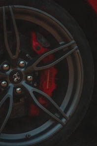 black and red car wheel
