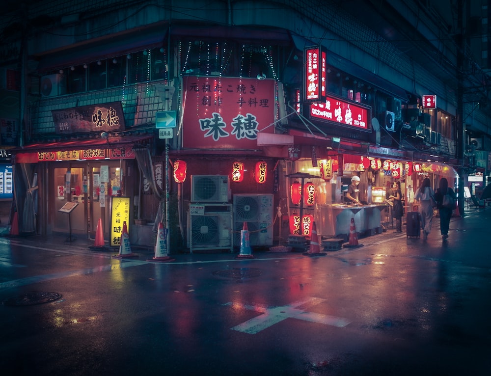 people walking on street during night time