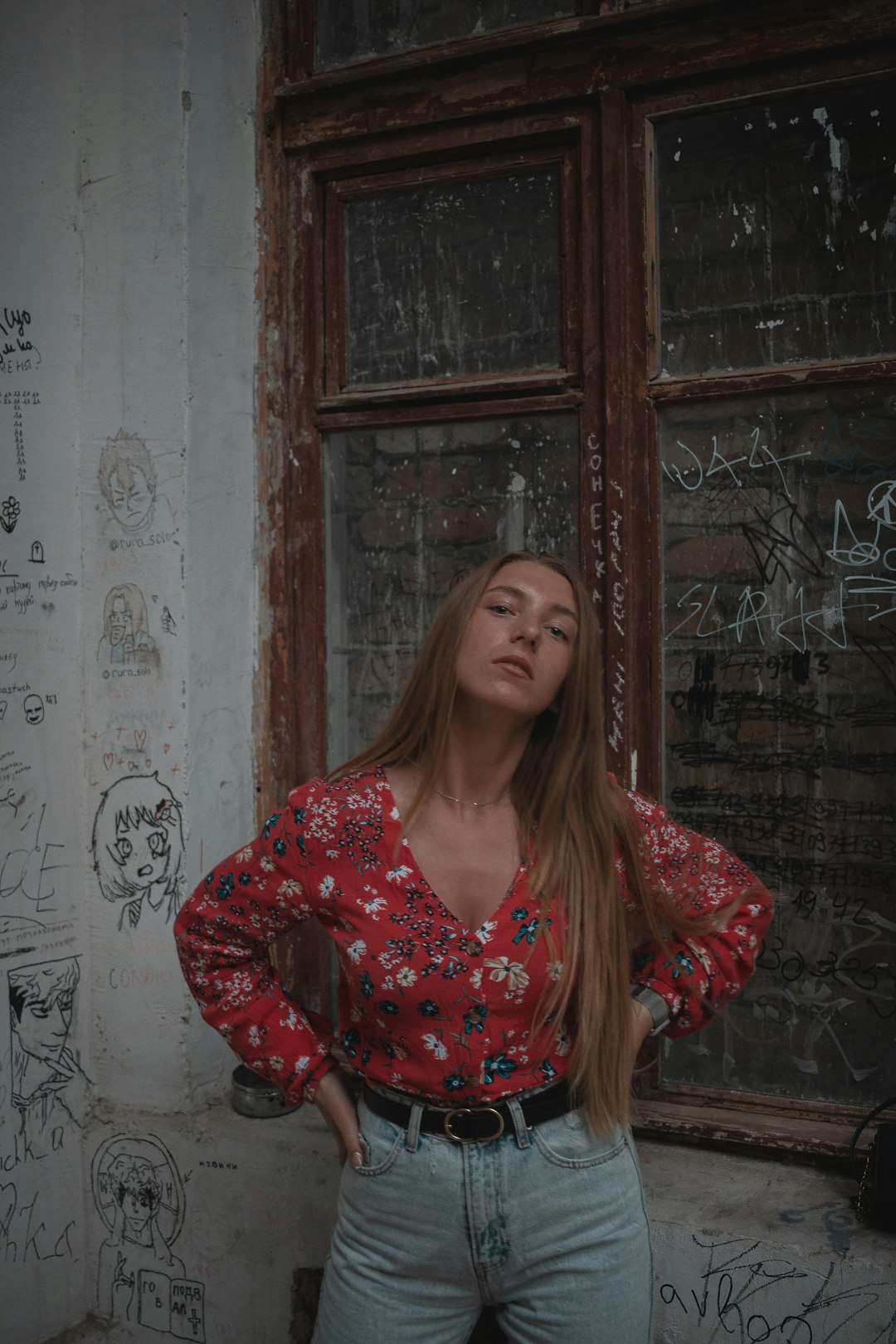 woman in red and white floral long sleeve shirt