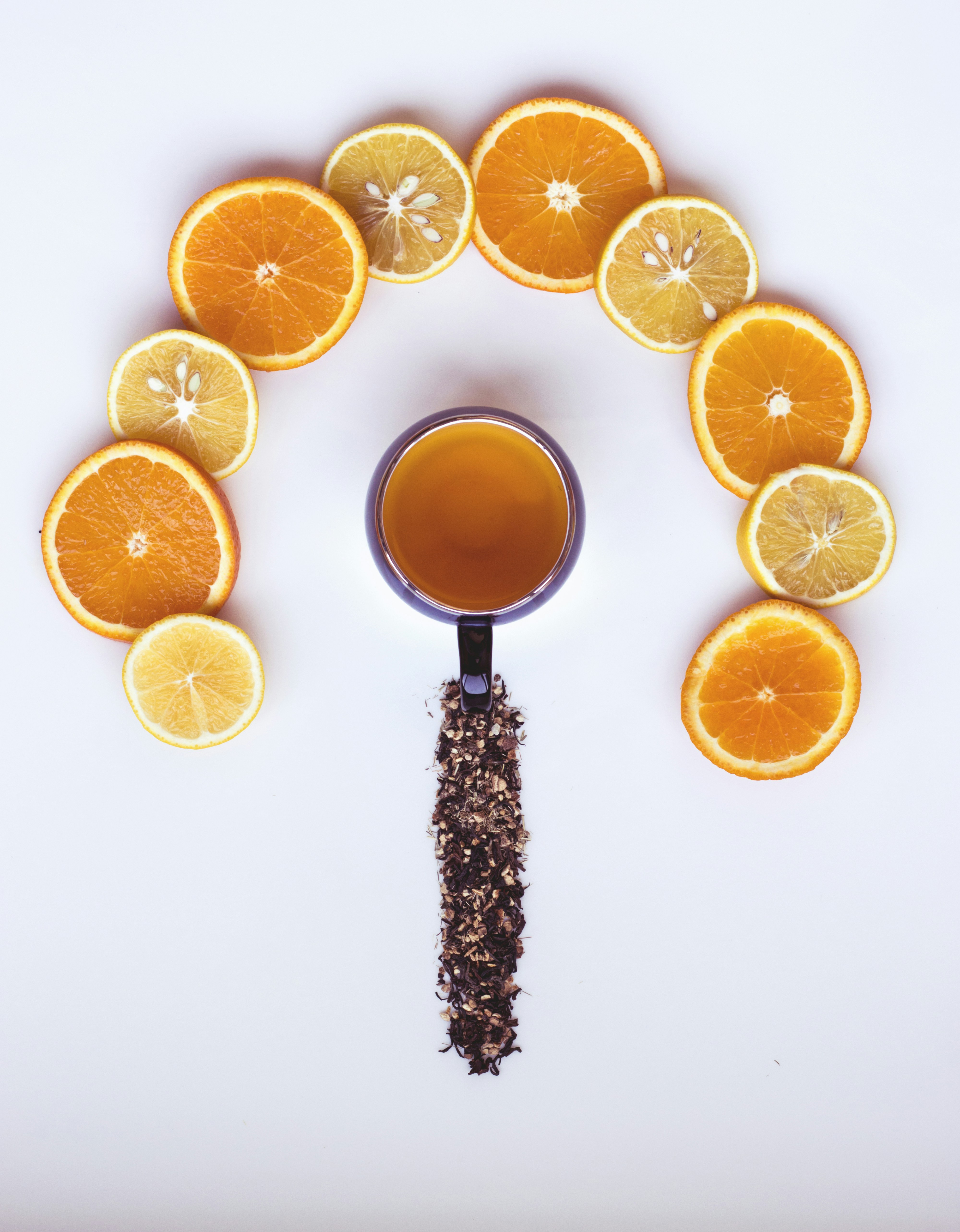 sliced orange fruit on white surface