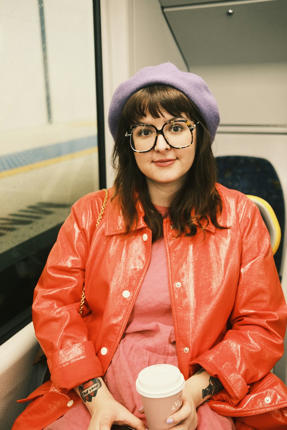 woman in red button up long sleeve shirt wearing black framed eyeglasses