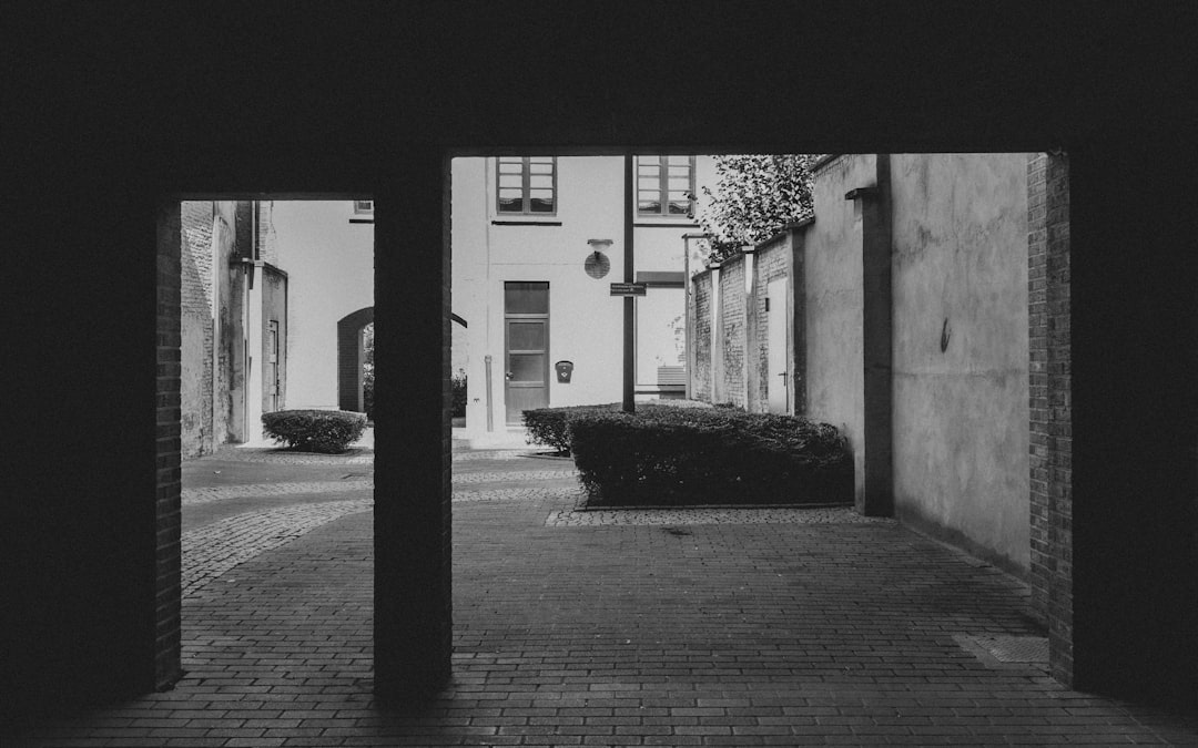 grayscale photo of empty hallway