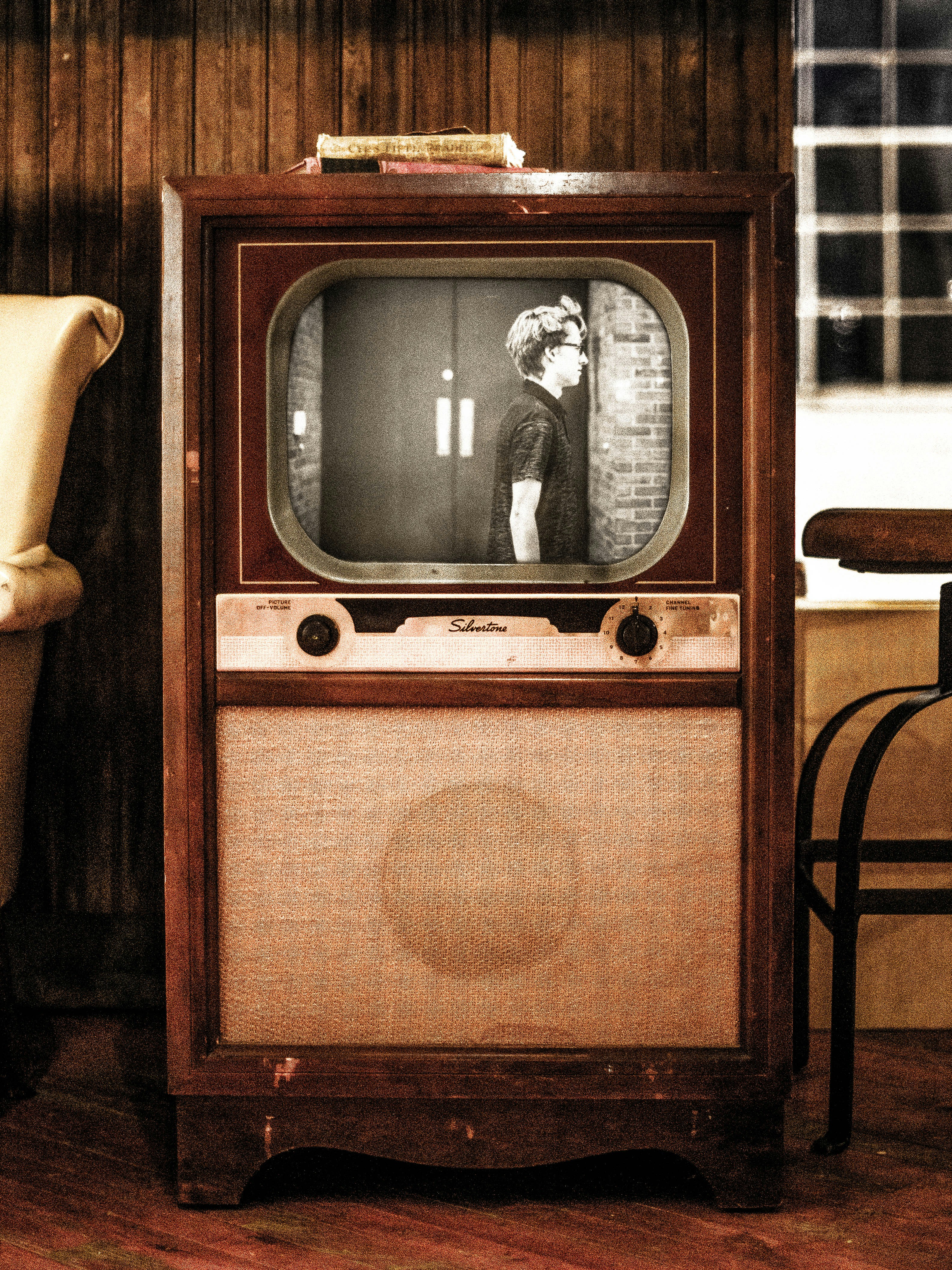 brown vintage radio on brown wooden table