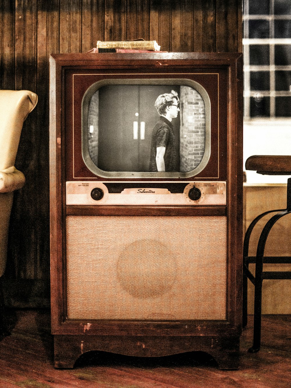 brown vintage radio on brown wooden table