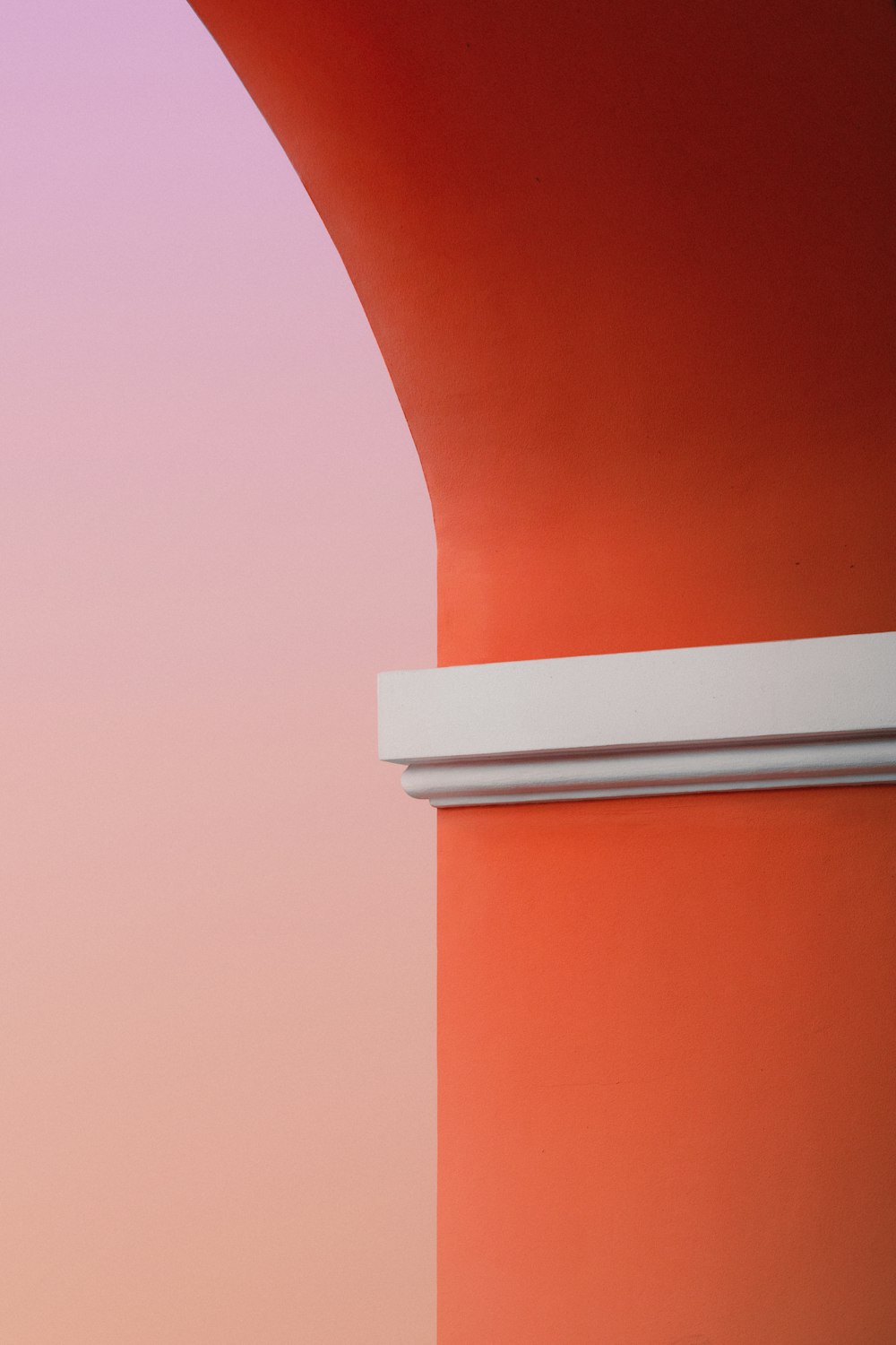 orange and white concrete pillar