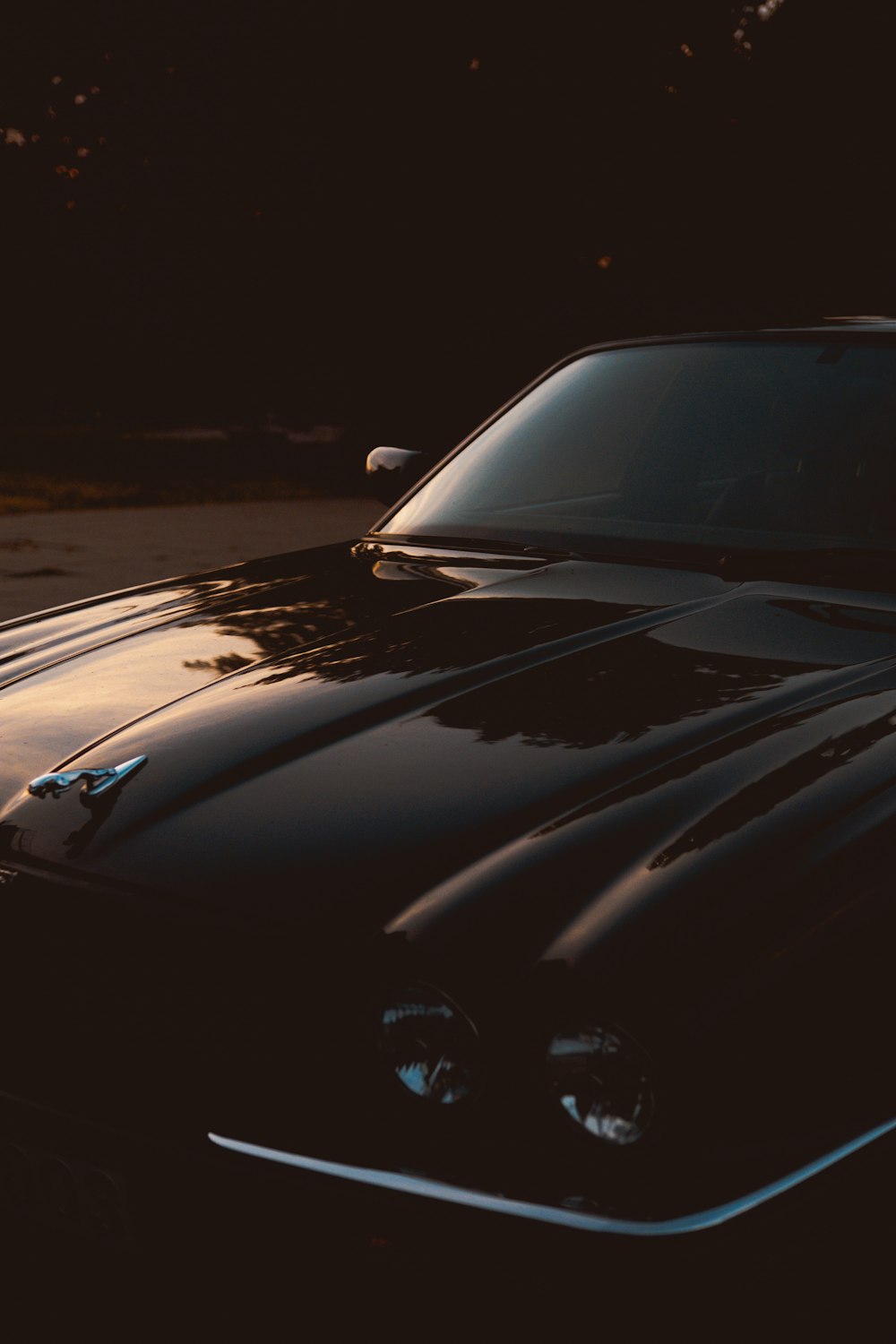 black car on black asphalt road during night time