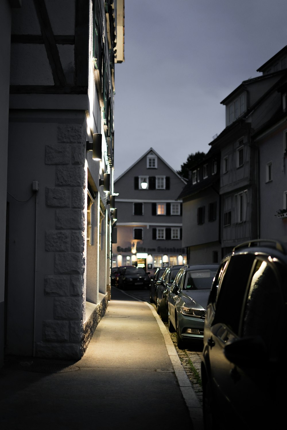 cars parked on side of the road during daytime