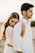 man in white long sleeve shirt hugging woman in white long sleeve shirt