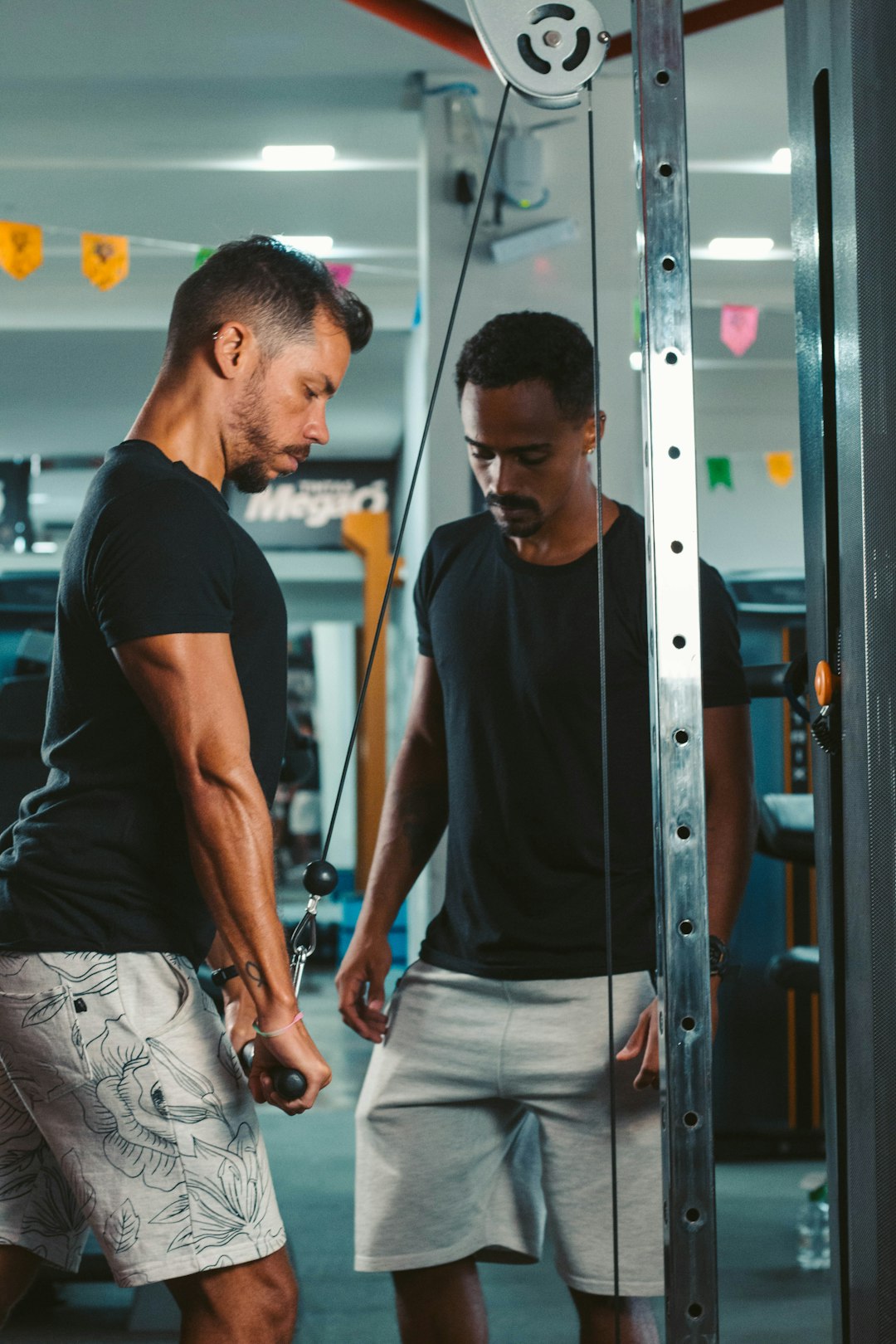 man in black crew neck t-shirt and white shorts